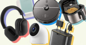 A vibrant collage-style composition featuring five trending Amazon products arranged in an overlapping, dynamic layout against a clean white background. The arrangement includes a sleek black robot vacuum cleaner in the center, premium noise-canceling wireless headphones in matte black positioned at an angle, a modern white security camera with its distinctive lens, a compact stainless steel air fryer with its basket partially visible, and a portable power bank with multiple charging cables.